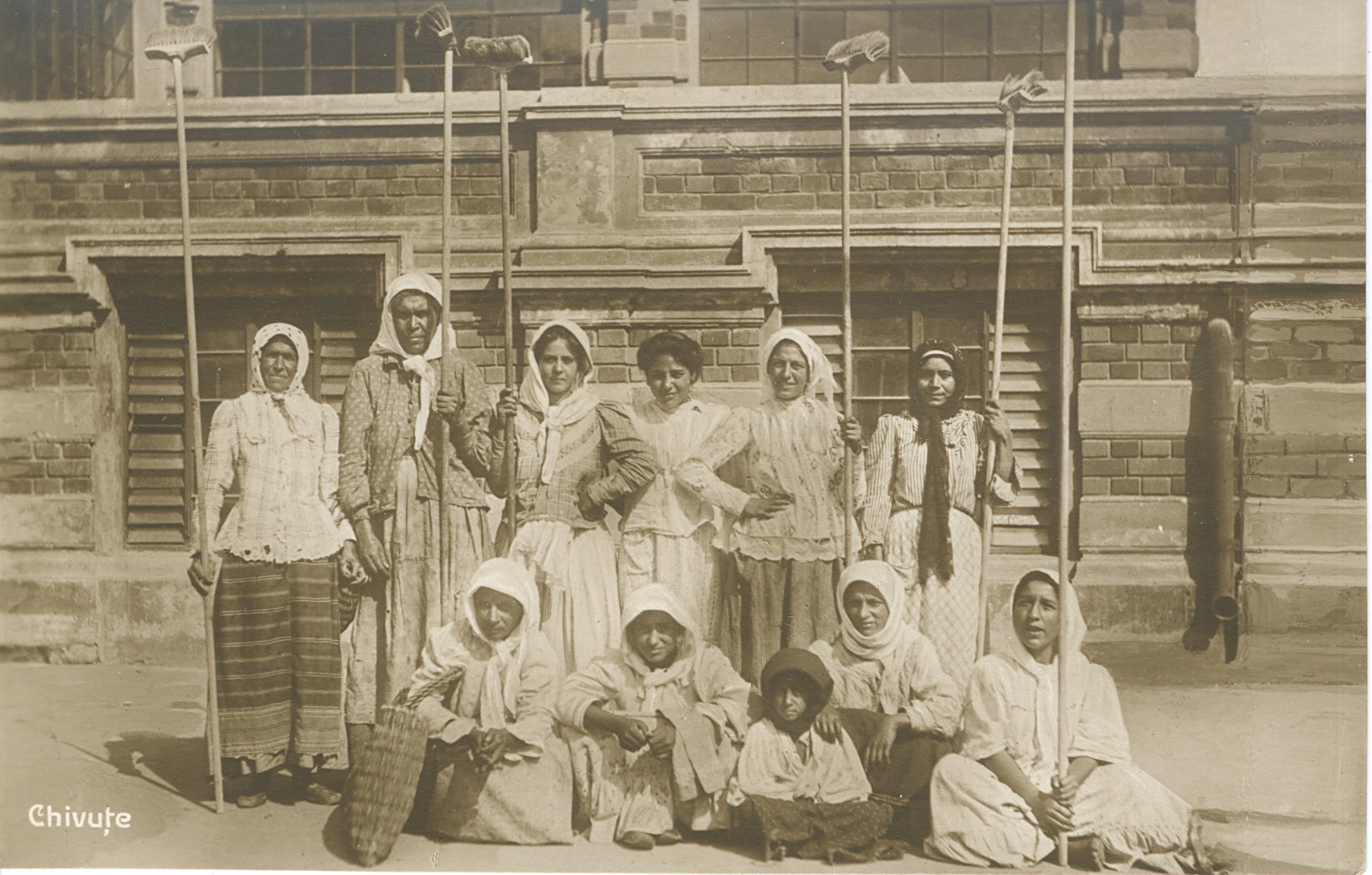 The National Archives, Romania, Roma women named ”chivuțe” who paint houses with brush, ref. RO-BU-F-01073-5-3087 