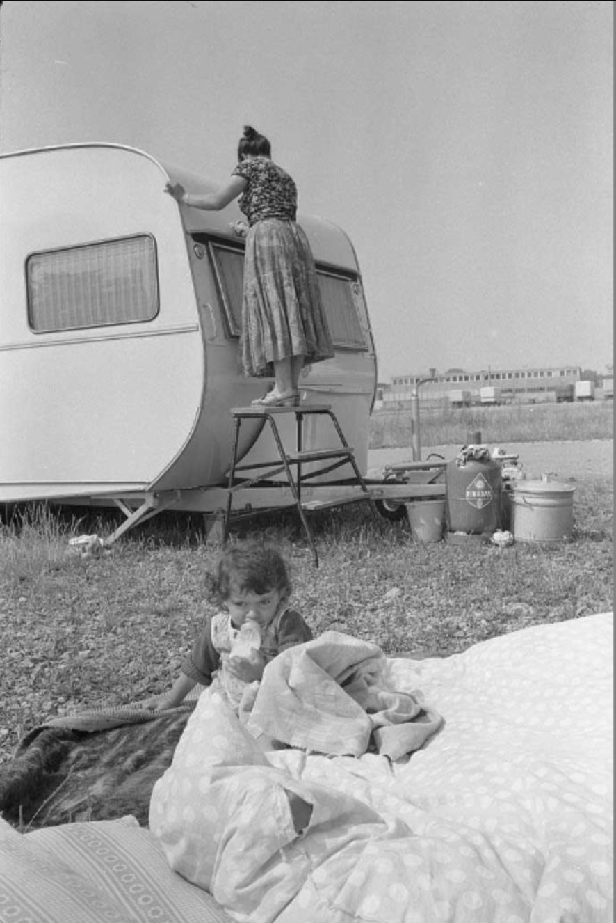 Stadtarchiv Karlsruhe, a woman and a small boy in a settlement of Sinti from all over Europe in Karlsruhe (1970), available here
